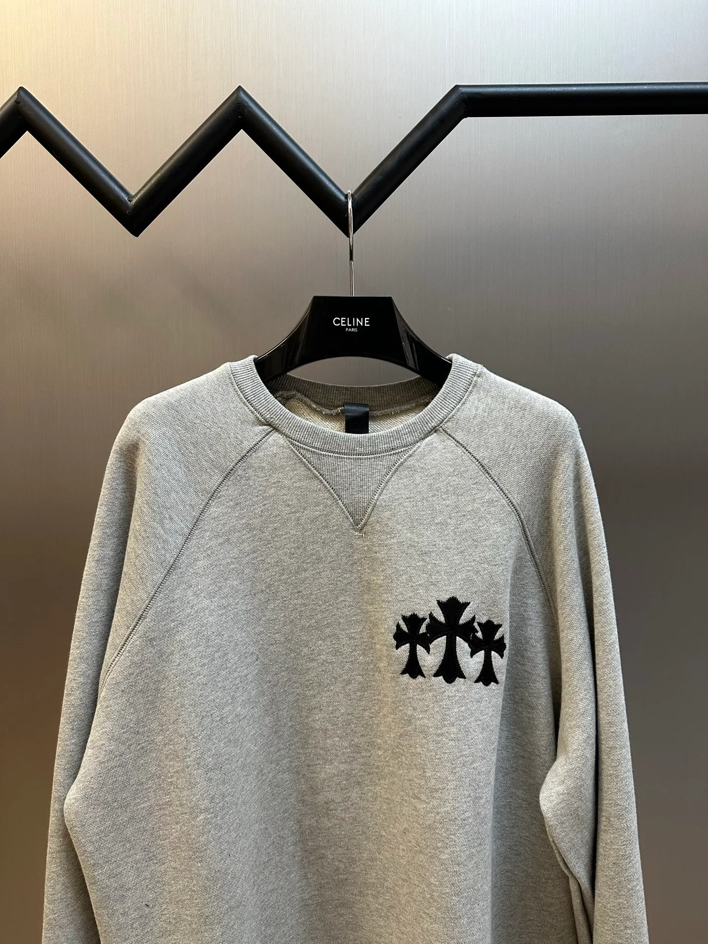 P410 Chrome Hearts Logo Round Neck Sweatshirt Made of custom-made heavy fortress intertwined air cotton fabric, Chrome Hearts cross patch embroidery decoration on the chest, becoming the ultimate interpretation of dark Gothic style. CH Gothic font is the finishing touch on the back panel. The logo iron plate sways slightly with the swing of the body, adding a sense of movement and vitality.  Using imported machine appliqué embroidery technology, advanced computer control systems and precision mechanical components are used to achieve the Chrome Hearts logo appliqué operation, presenting an embroidery effect with both clarity and three-dimensionality.  size：s m l xl